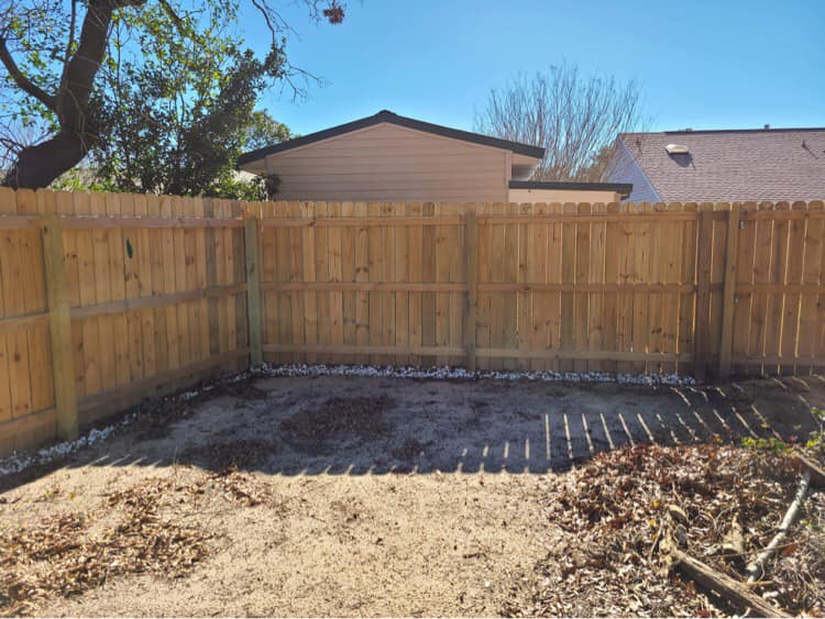 backside of yard fence in corner